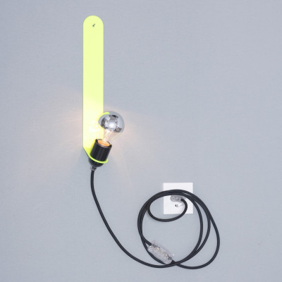 The Skipper wall light in neon yellow casts a lovely glow and looks great anywhere