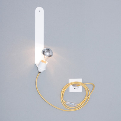 Modern wall light in white with a long yellow fabric cable and a mirrored bulb